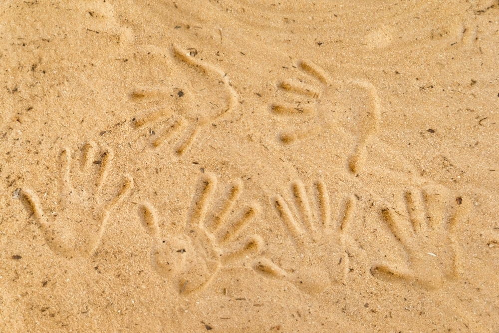 Handprints in sand - Australian Stock Image