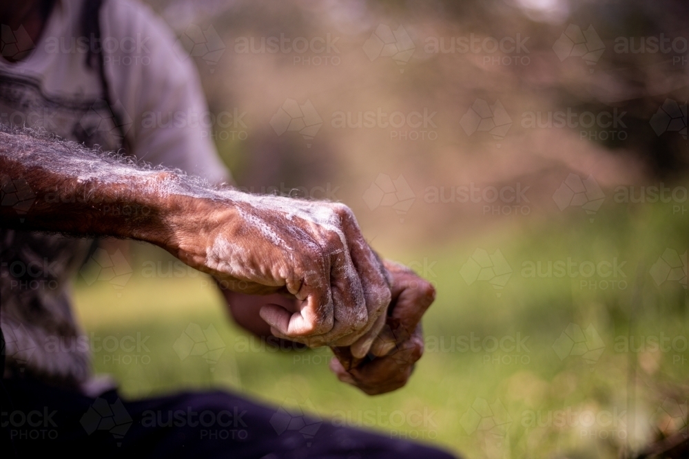 Hands with white paint on them - Australian Stock Image