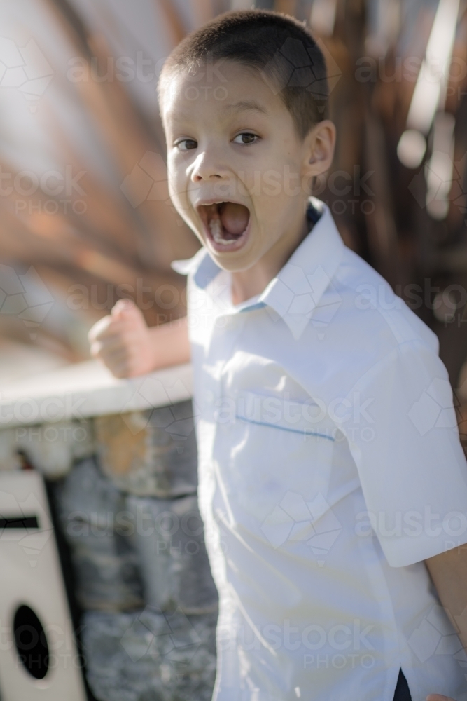 Handsome boys in school uniform leave home for their first day of school - Australian Stock Image