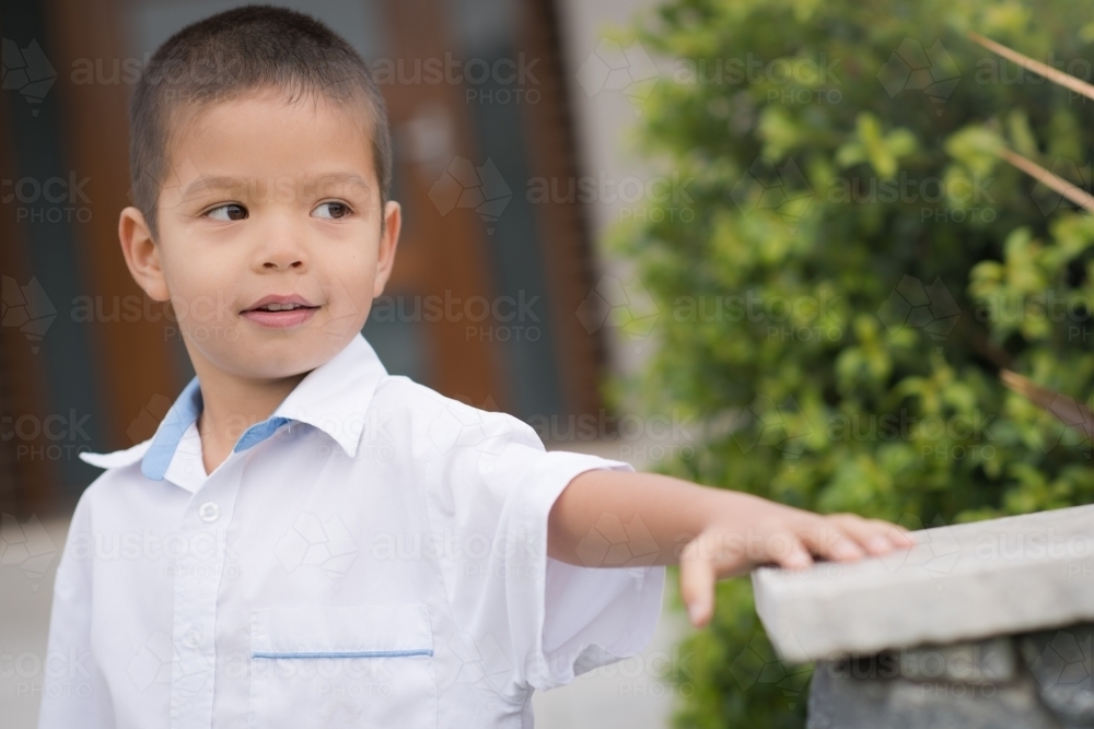 Handsome boys in school uniform leave home for their first day of school - Australian Stock Image