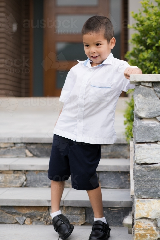 Handsome boys in school uniform leave home for their first day of school - Australian Stock Image