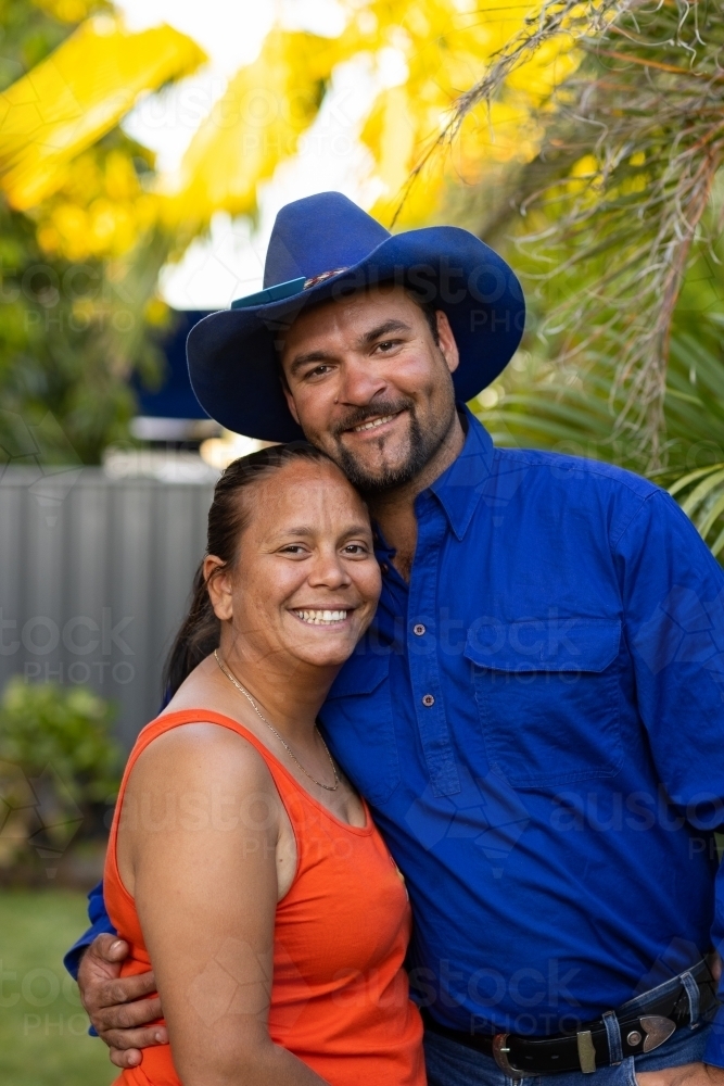 happy aboriginal couple close together and smiling - Australian Stock Image