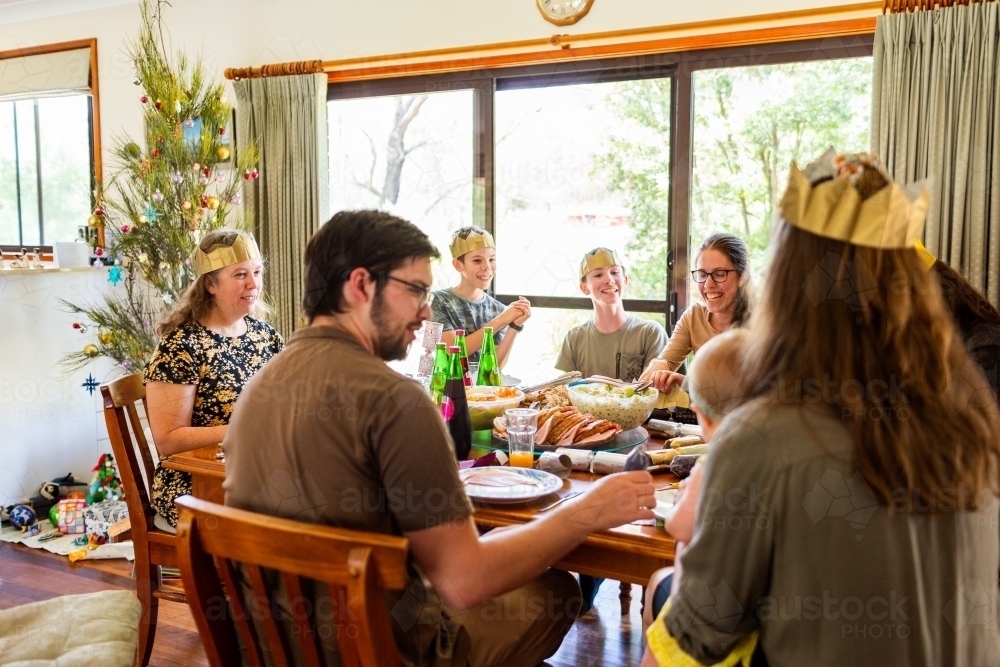 Happy big family around dining table at Christmas lunch - Australian Stock Image