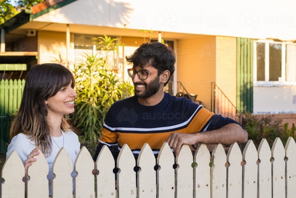 happy couple in front of their home - Australian Stock Image