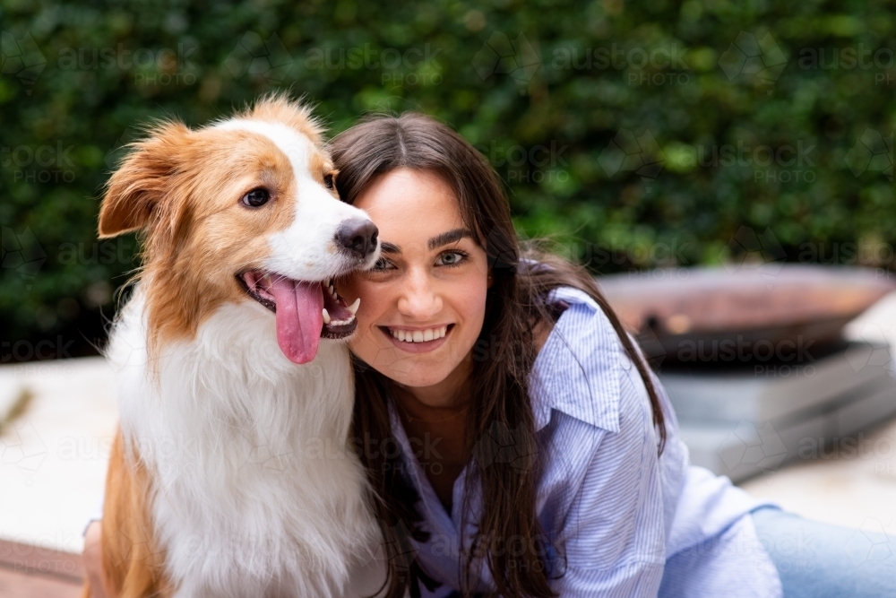 Image of happy dog with owner - Austockphoto