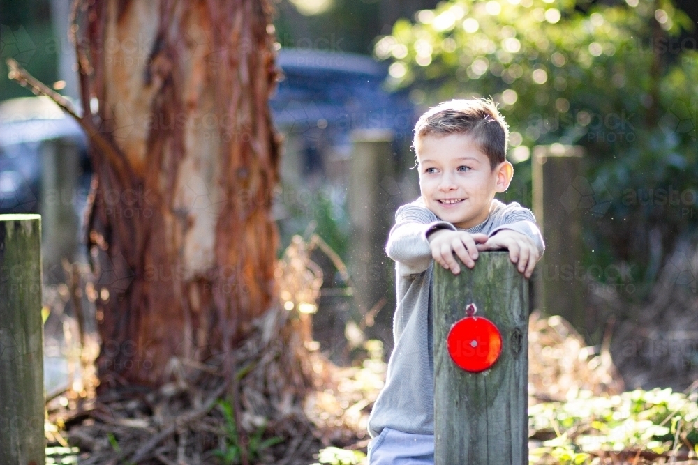 Happy little boy laughing outside - Australian Stock Image