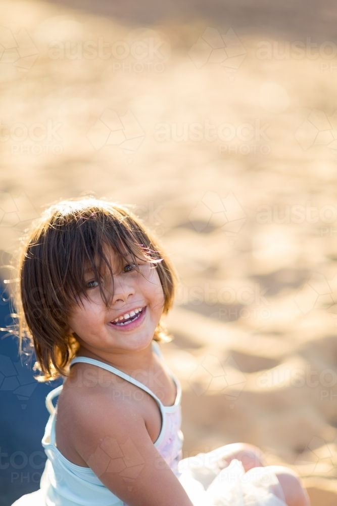 Happy little girl with messy hair - Australian Stock Image