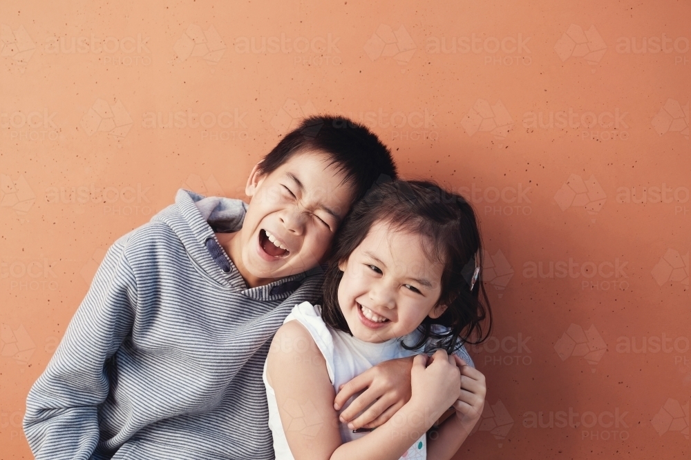 Happy multicultural boy and girl - Australian Stock Image