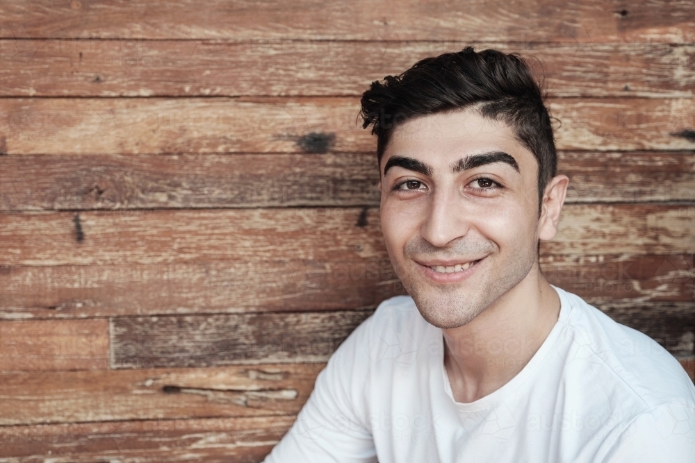 Happy multicultural young adult man, university student - Australian Stock Image