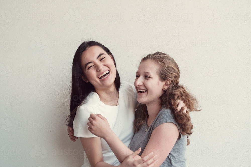 Happy students girl friends - Australian Stock Image