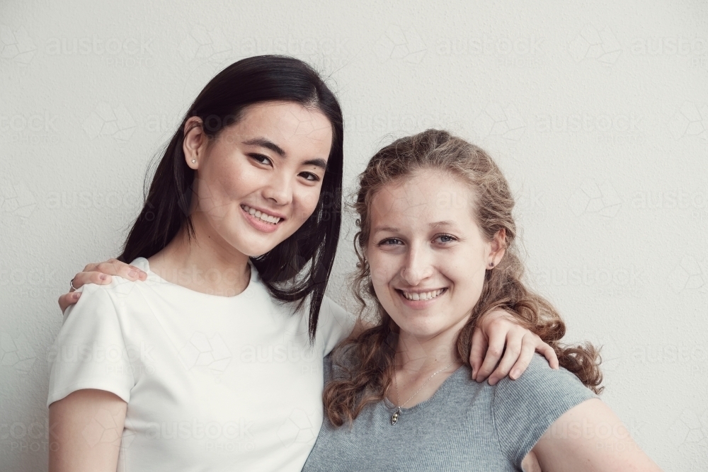 Happy students girl friends - Australian Stock Image