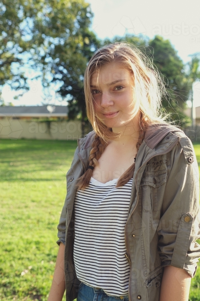 Happy teenage girl in the park - Australian Stock Image