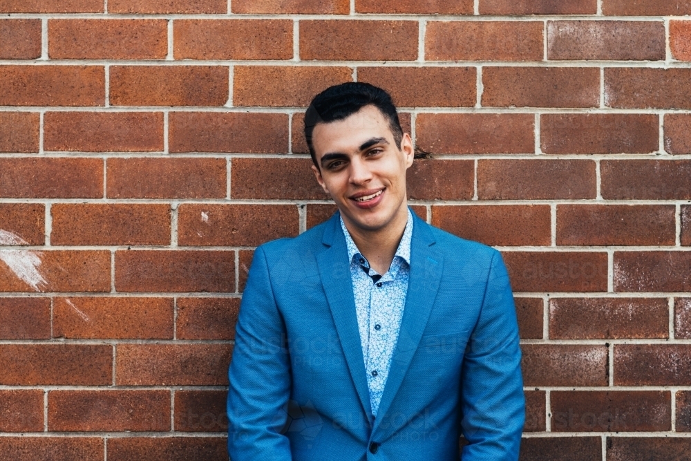 happy young man, in blue suit - Australian Stock Image