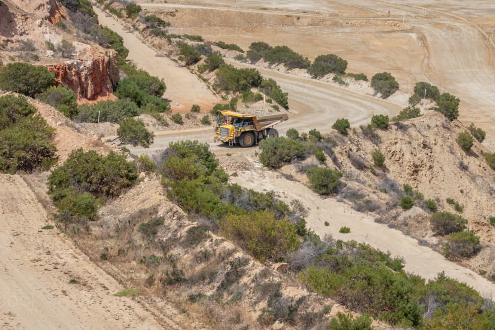 Haul truck driving out of open cut mine with a full load - Australian Stock Image