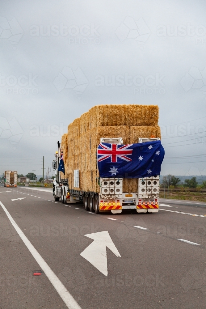 Hay in road train being transported across Australia to aid farmers in drought - Australian Stock Image