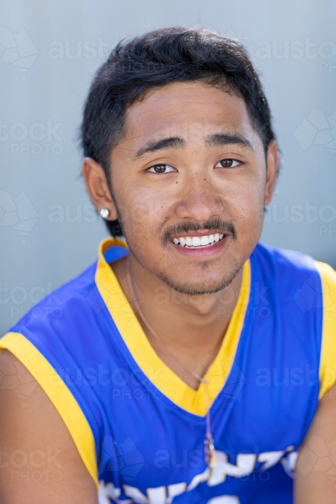 head and shoulders of teenage boy smiling - Australian Stock Image