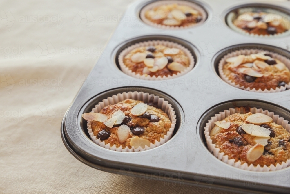 Healthy oatmeal cupcake in baking tray - Australian Stock Image