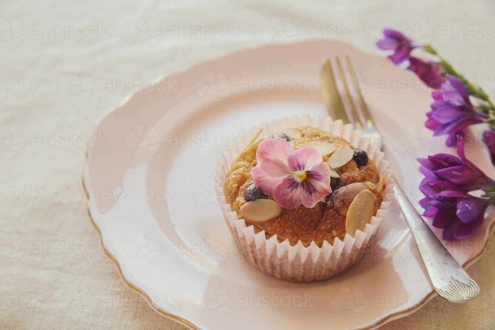 Healthy oatmeal cupcake on vintage plate - Australian Stock Image