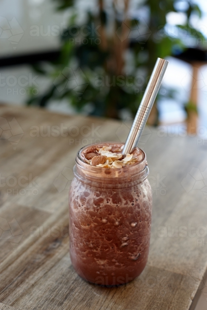 Healthy vegetarian smoothie on wooden table - Australian Stock Image