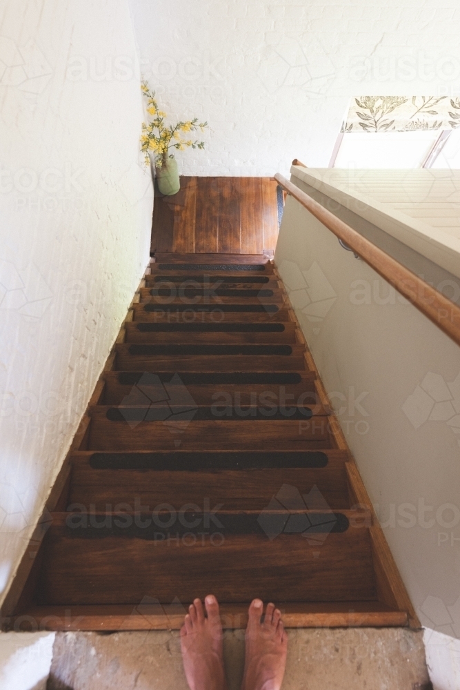 High angle shot of stairwell with feet at the top - Australian Stock Image