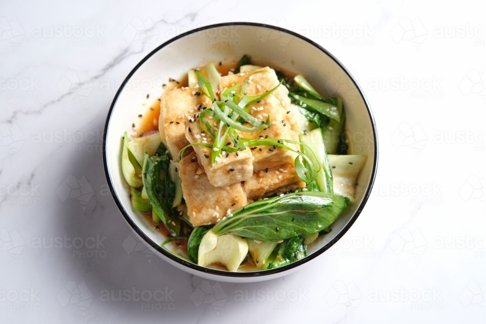 Hoisin tofu pho garnished with black sesame seeds. - Australian Stock Image