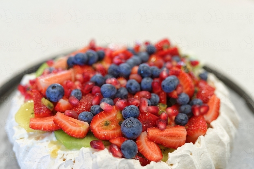 Home made traditional Australian Pavlova with fruit topping - Australian Stock Image