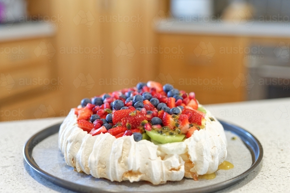 Homemade traditional Australian Pavlova with strawberries, blueberries and kiwi fruit topping - Australian Stock Image