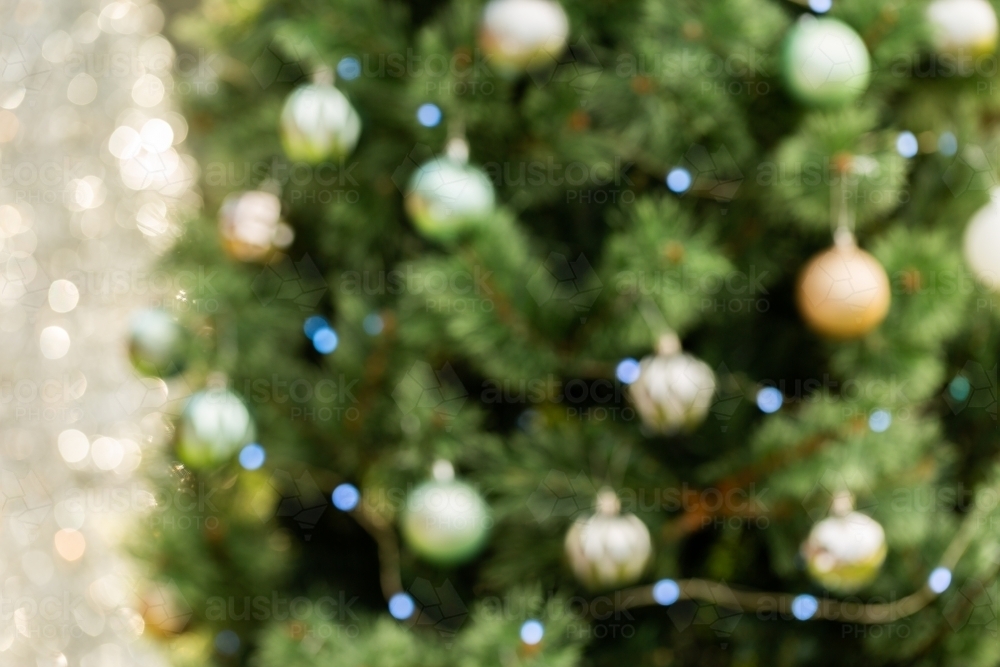 Horizontal image of Christmas bokeh - tree with lights and baubles - Australian Stock Image