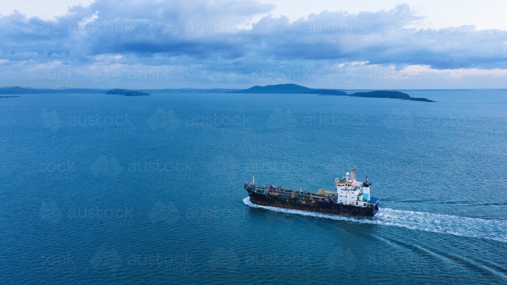 Horizontal shot of a ship travelling from right to left - Australian Stock Image