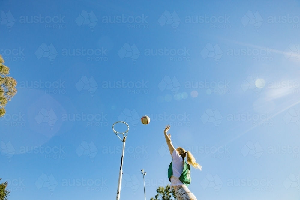 horizontal shot of a young woman celebrating after scoring in a net ball game - Australian Stock Image