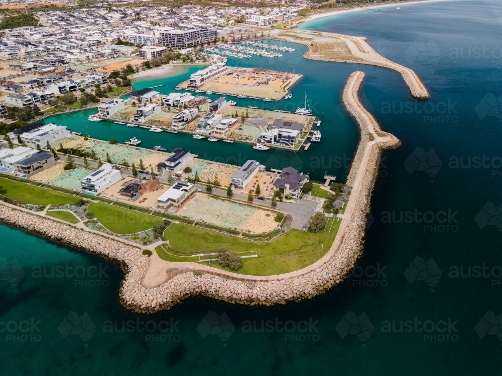 horizontal shot of an island with buildings, roads, trees and cars on a sunny day - Australian Stock Image