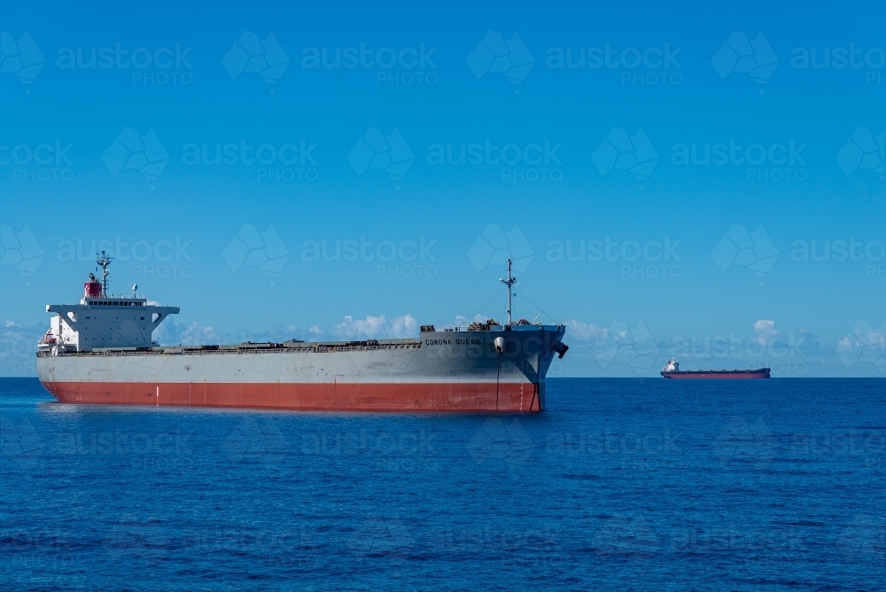 Horizontal shot of cargo ships at Coral Sea - Australian Stock Image