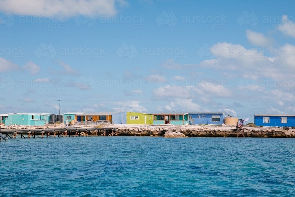 Horizontal shot of colorful fishing shacks - Australian Stock Image