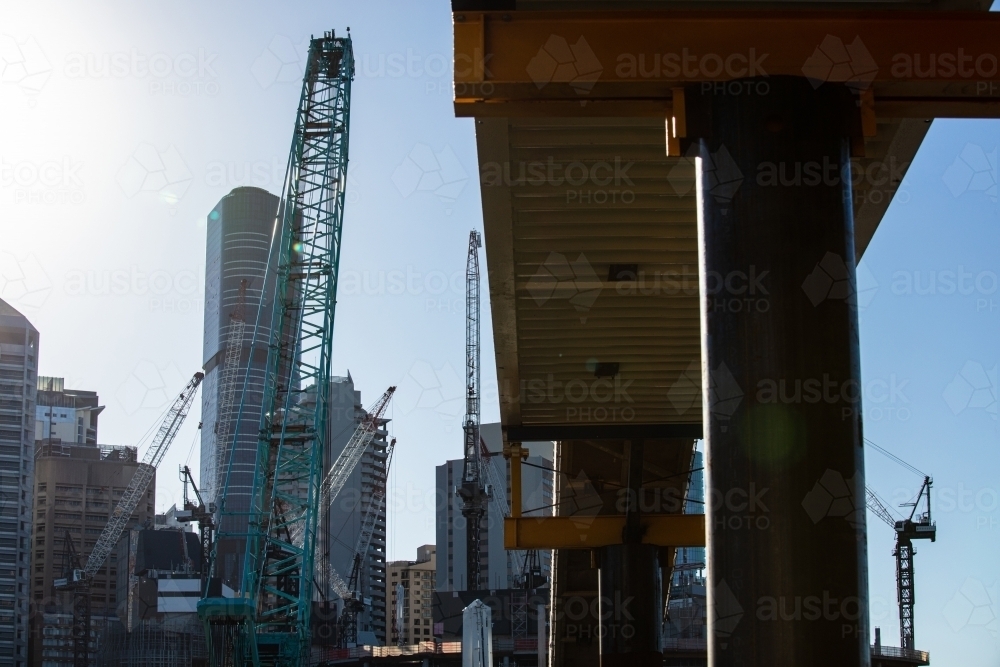 Horizontal shot of high rise buildings and cranes construction site - Australian Stock Image