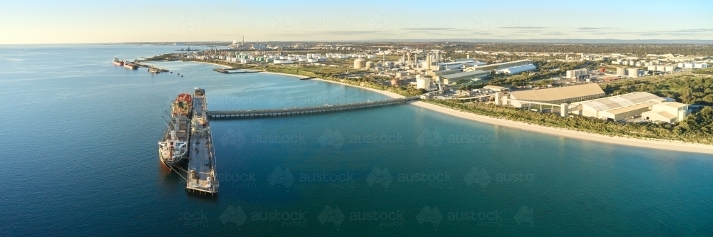 horizontal shot of Kwinana bulk jetty with large ship docked at the port - Australian Stock Image