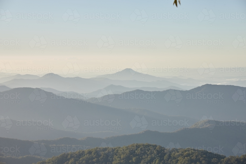 Horizontal shot of mountains on a misty day - Australian Stock Image