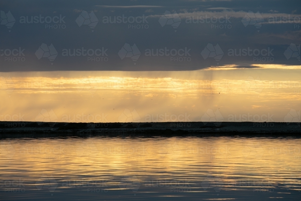 Horizontal shot of ocean on stormy skies - Australian Stock Image