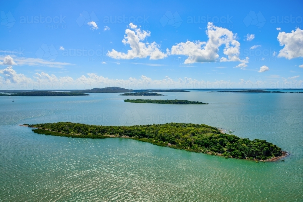 Horizontal shot of Picnic Island, Port Curtis, near Gladstone, Queensland - Australian Stock Image