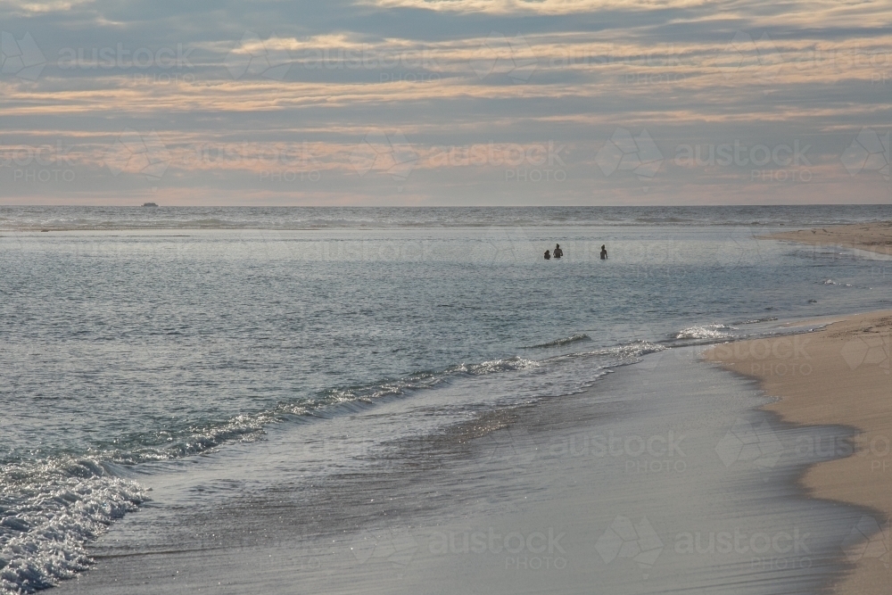 Horizontal shot of sea shore at sunset. - Australian Stock Image