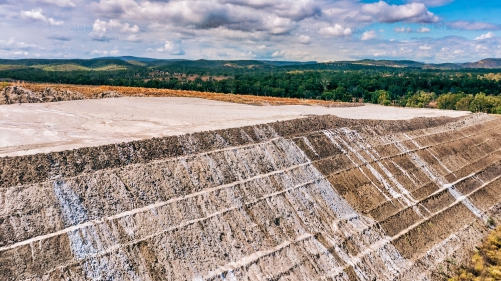 Horizontal shot of Stanwell power station and ash piles - Australian Stock Image