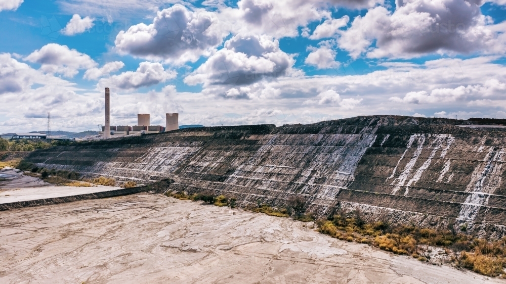 Horizontal shot of Stanwell power station ash piles, Queensland - Australian Stock Image