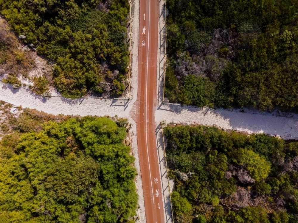 horizontal shot of Summers in Perth with white sand, green bushes, trees. and a road - Australian Stock Image