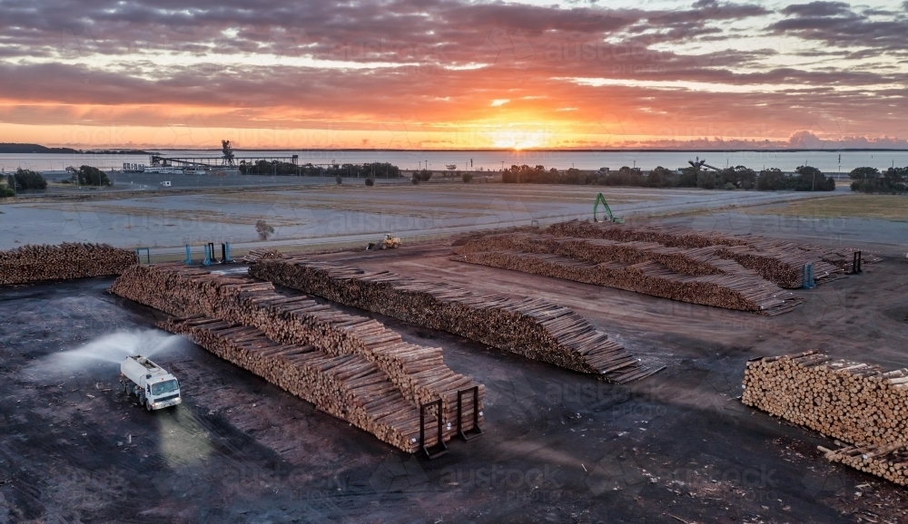 Horizontal shot of timber piles at sunset - Australian Stock Image