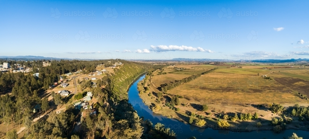 Houses on cliff edge with view over farmland - Australian Stock Image