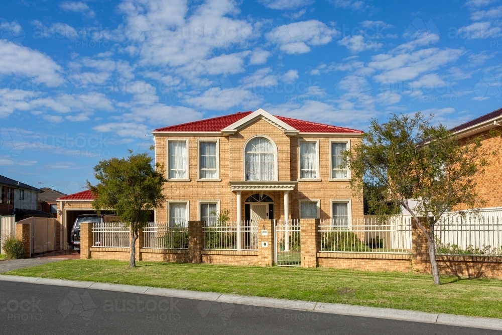 Housing affordability concept - brick double story house - Australian Stock Image