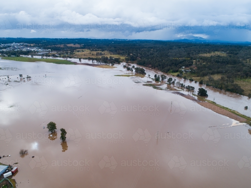 Hunter river during flood with floodwater covering farmland in Singleton - Australian Stock Image