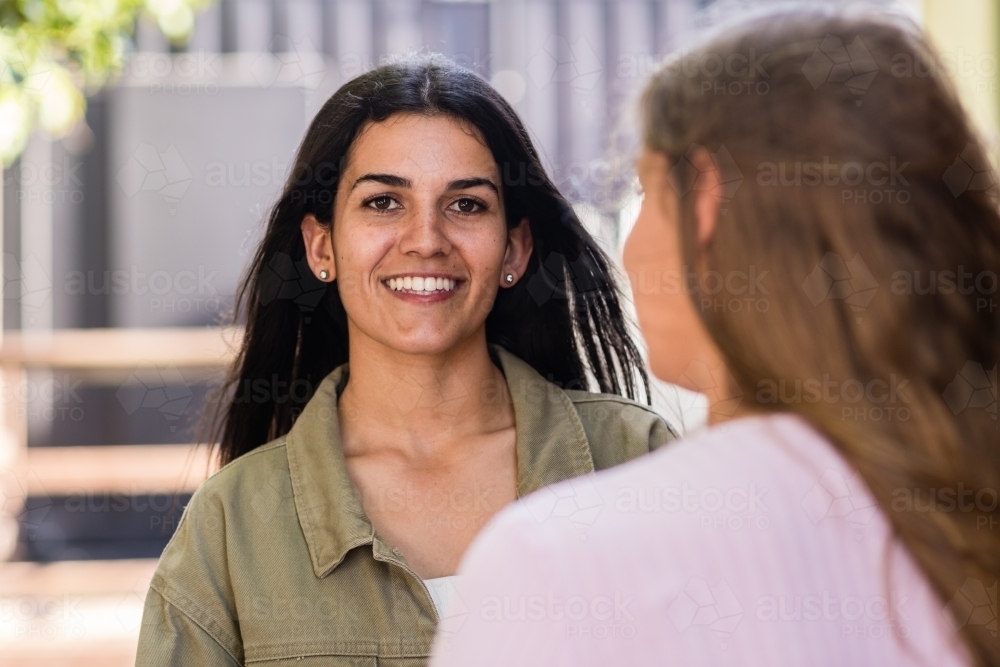 indigenous australian women talking to her friend - Australian Stock Image