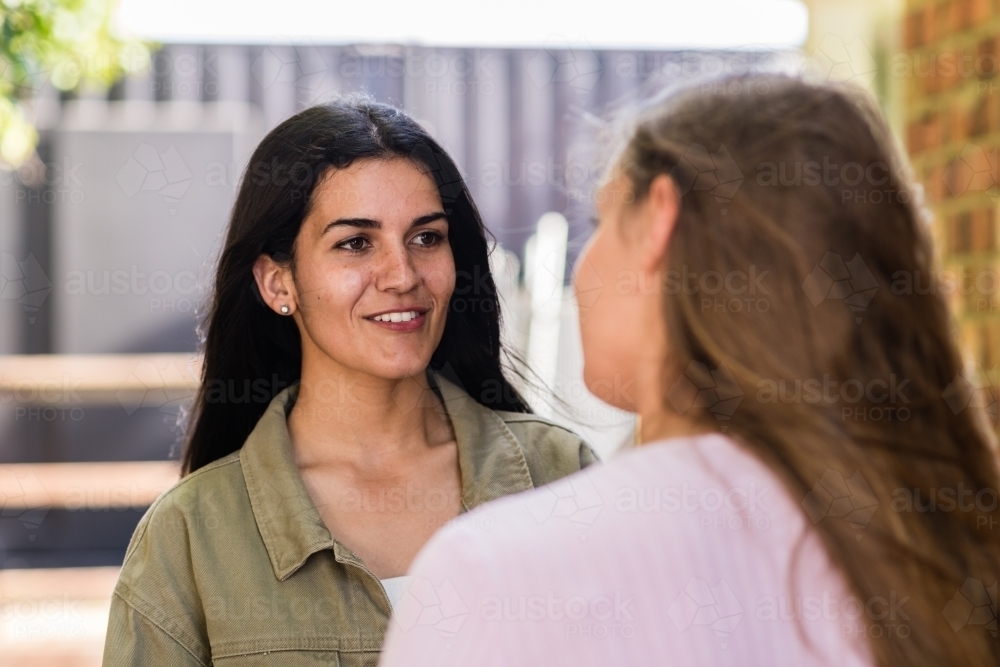 indigenous australian women talking to her friend - Australian Stock Image