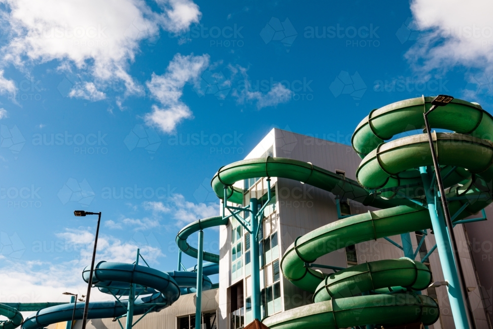 Indoor outdoor waterslides coming from building along the foreshore at Glenelg - Australian Stock Image