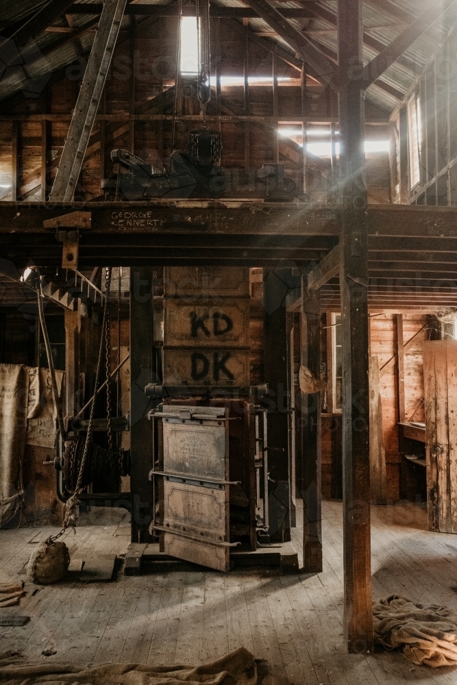 Inside shearing shed with rays of sunlight. - Australian Stock Image